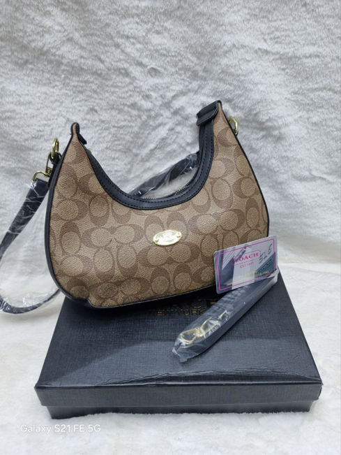 Coach-New-York-women-handbag-with-the-signature-monogram-pattern